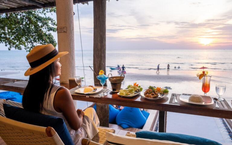 dinner-during-sunset-with-fish-thai-food-women-watching-sunset